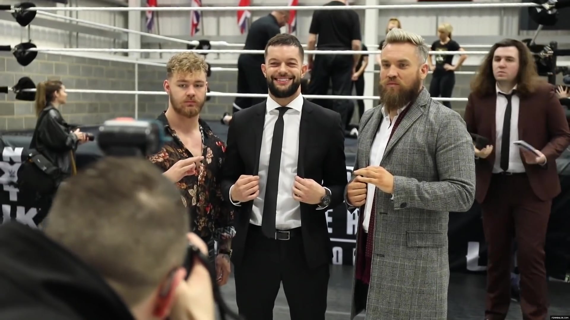 WWE_Superstar_FINN_BALOR_joins_MOUSTACHE_MOUNTAIN_at_the_opening_of_the_NXT_UK_PC_042.jpg